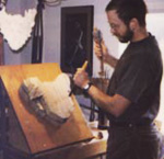 Paul Borda carving a block of wood